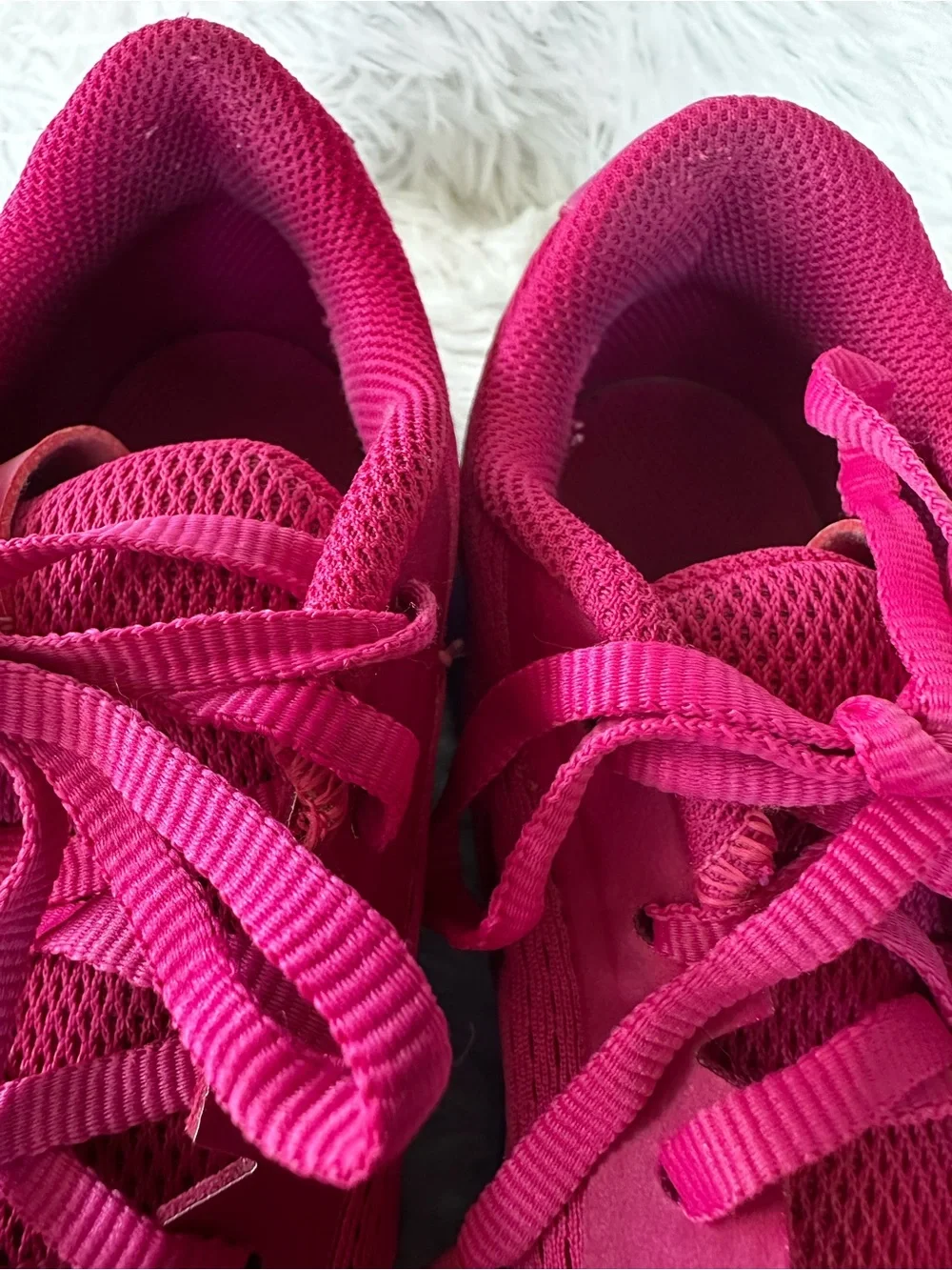 Nike Women's Bold Pink Athletic Court Shoes with Teal Purple Gradient Accent.